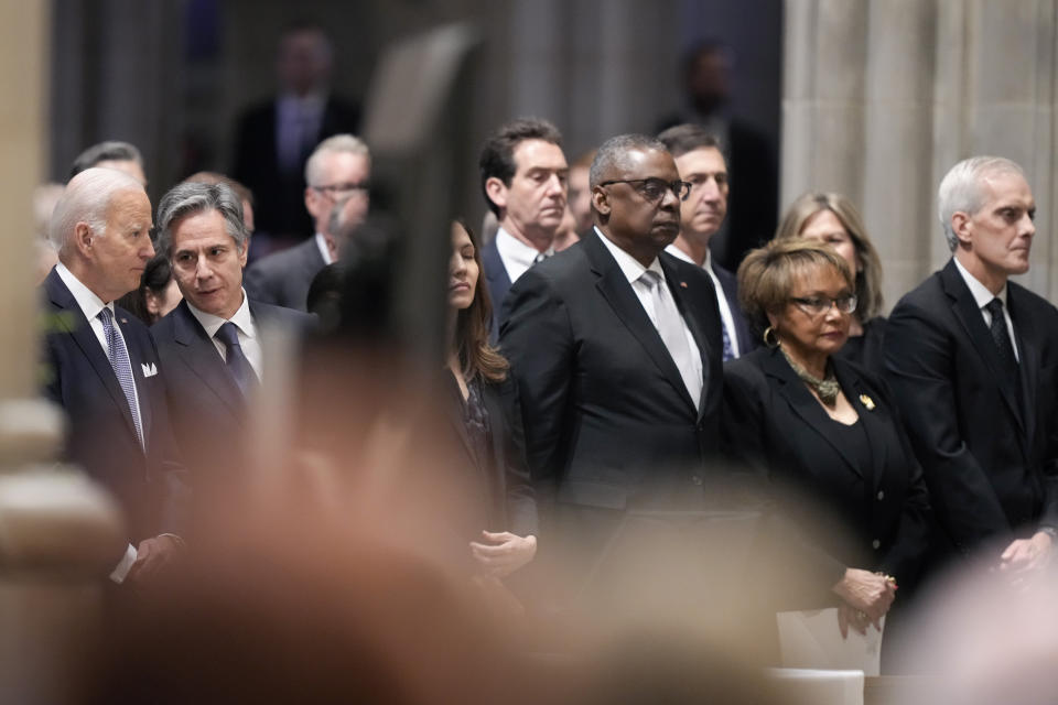 President Joe Biden, from left, Secretary of State Antony Blinken, Defense Secretary Lloyd Austin and his wife Charlene Austin and Veterans Affairs Secretary Denis McDonough, right, attend a memorial service for former Secretary of Defense Ash Carter at the National Cathedral, Thursday, Jan. 12, 2023, in Washington. (AP Photo/Andrew Harnik)