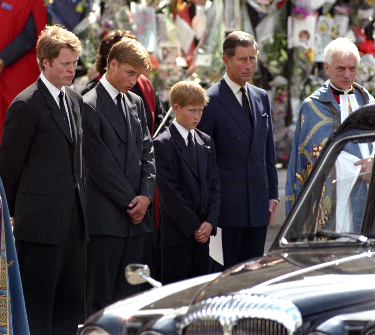PA News photo dated September 1997. Pictured: The Earl Spencer, Prince William, Prince Harry and The Prince of Wales wait as the hearse carrying the coffin of Diana, Princess of Wales prepares to leave Westminster Abbey following her funeral service. PA Feature SHOWBIZ Film Reviews. Picture credit should read: PA Archive/PA Images/Fiona Hanson. All Rights Reserved. WARNING: This picture must only be used to accompany PA Feature SHOWBIZ Film Reviews. (Photo by PA Images via Getty Images)