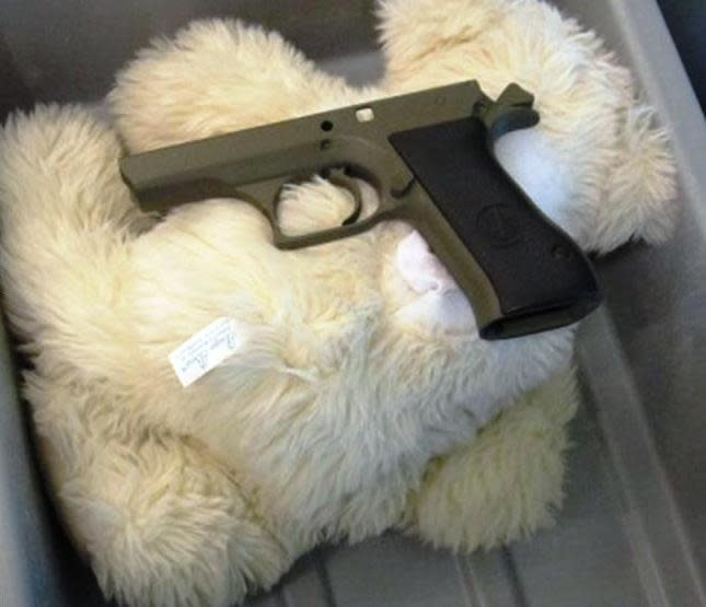 This undated photo provided by the federal Transportation Security Administration shows pistol parts hidden in a stuffed animal found by TSA officials at T.F. Green Airport in Warwick, R.I., Monday May 7, 2012. The TSA said Tuesday that a man traveling to Detroit with his 4-year-old son was stopped when a TSA officer noticed the disassembled gun components "artfully concealed" inside three stuffed animals. The stuffed animals were inside a carry-on bag that was put through an x-ray machine as part of normal security screening. (AP Photo/Transportation Security Administration)