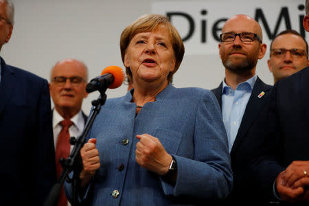 Christian Democratic Union CDU party leader and German Chancellor Angela Merkel reacts after winning the German general election (Bundestagswahl) in Berlin, Germany, September 24, 2017. REUTERS/Kai Pfaffenbach