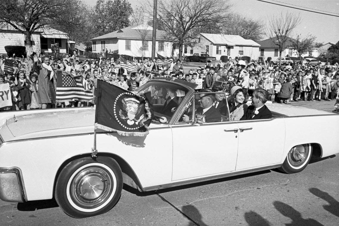 Presidential motorcade driving through Fort Worth on the way to Carswell Air Force Base to fly to Love Field in Dallas; John F. Kennedy, Jackie Kennedy, and Gov. John Connally in the back seat. Nov. 22, 1963