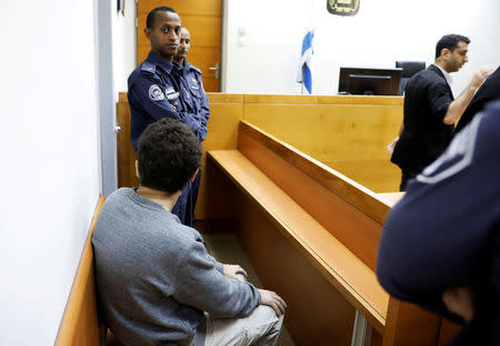 FILE PHOTO: An U.S. - Israeli teen, who was arrested in Israel on suspicion of making bomb threats against Jewish community centres in the United States, Australia and New Zealand, is seen before the start of a remand hearing at Magistrate's Court in Rishon Lezion, Israel April 20, 2017. REUTERS/Amir Cohen/File Photo