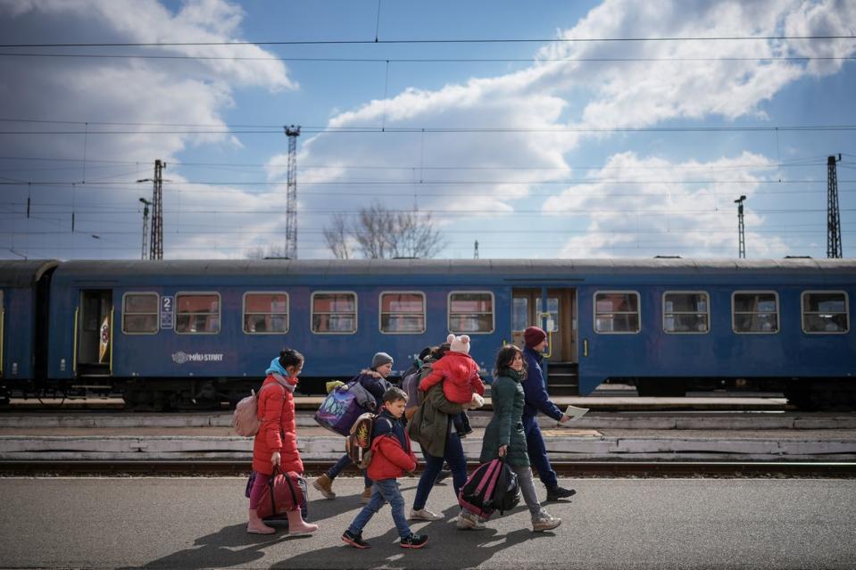 Refugees fleeing Ukraine arrive at the border train station of Zahony on March 10, 2022 in Zahony, Hungary. More than 2 million refugees have fled Ukraine since the start of Russia's military offensive, according to the UN. Hungary, one of Ukraine's neighbouring countries, has welcomed more than 144,000 refugees fleeing Ukraine after Russia began a large-scale attack on Ukraine on Feb. 24. (Christopher Furlong/Getty Images)