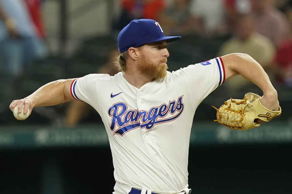 Texas Rangers starting pitcher Jon Gray throws during the first inning of a baseball game against the Los Angeles Angels in Arlington, Texas, Monday, May 16, 2022. (AP Photo/LM Otero)