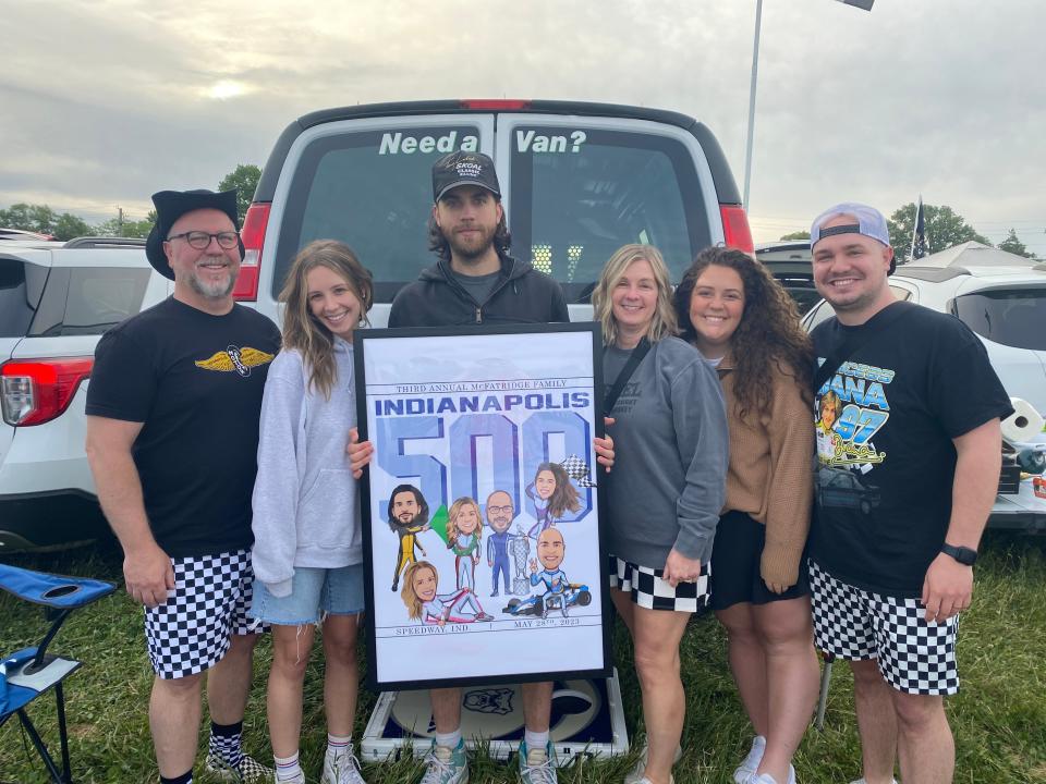 Mark McFatridge and his family cooked breakfast burritos and set up a coffee bar as they waited for Indy 500 events to start. They commissioned a race-themed cartoon family portrait from a freelance artist via Fiverr and brought it to help set the mood at this year's race.