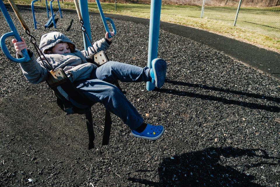 Cashton Field, 8, swings at the Starlight School playground. The playground will be revamped, thanks to a state grant.