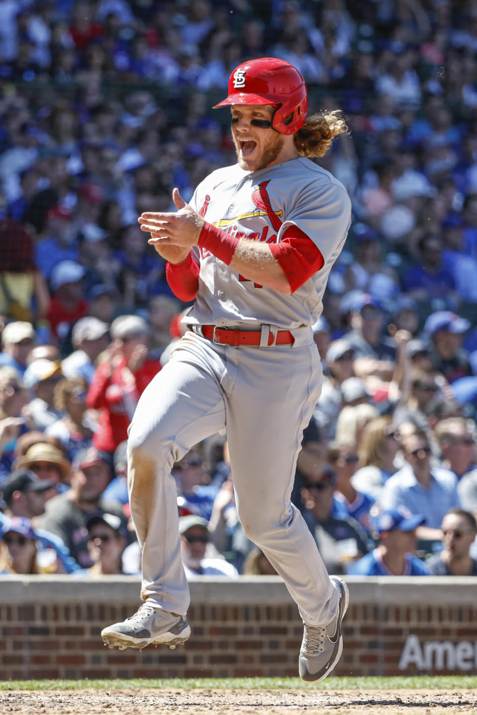 St. Louis Cardinals' Harrison Bader smiles after scoring against the Chicago Cubs during the fourth inning of a baseball game, Friday, June 3, 2022, in Chicago. (AP Photo/Kamil Krzaczynski)