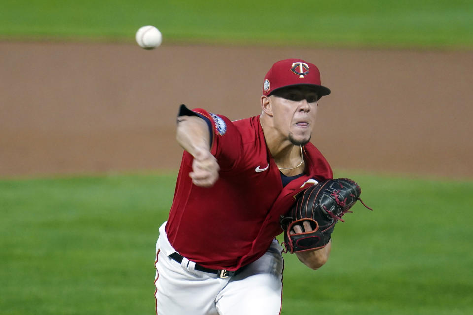 Minnesota Twins pitcher Jose Berrios throws to a Cincinnati Reds batter during the first inning of a baseball game Friday, Sept. 25, 2020, in Minneapolis. (AP Photo/Jim Mone)