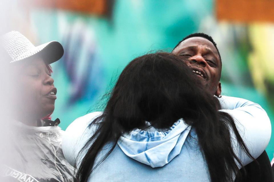 Carlton Harris, center, the father of missing 3-year-old Major Harris, reacts after hearing the news his son was found dead Thursday afternoon. Major's body was found in a storage bin.