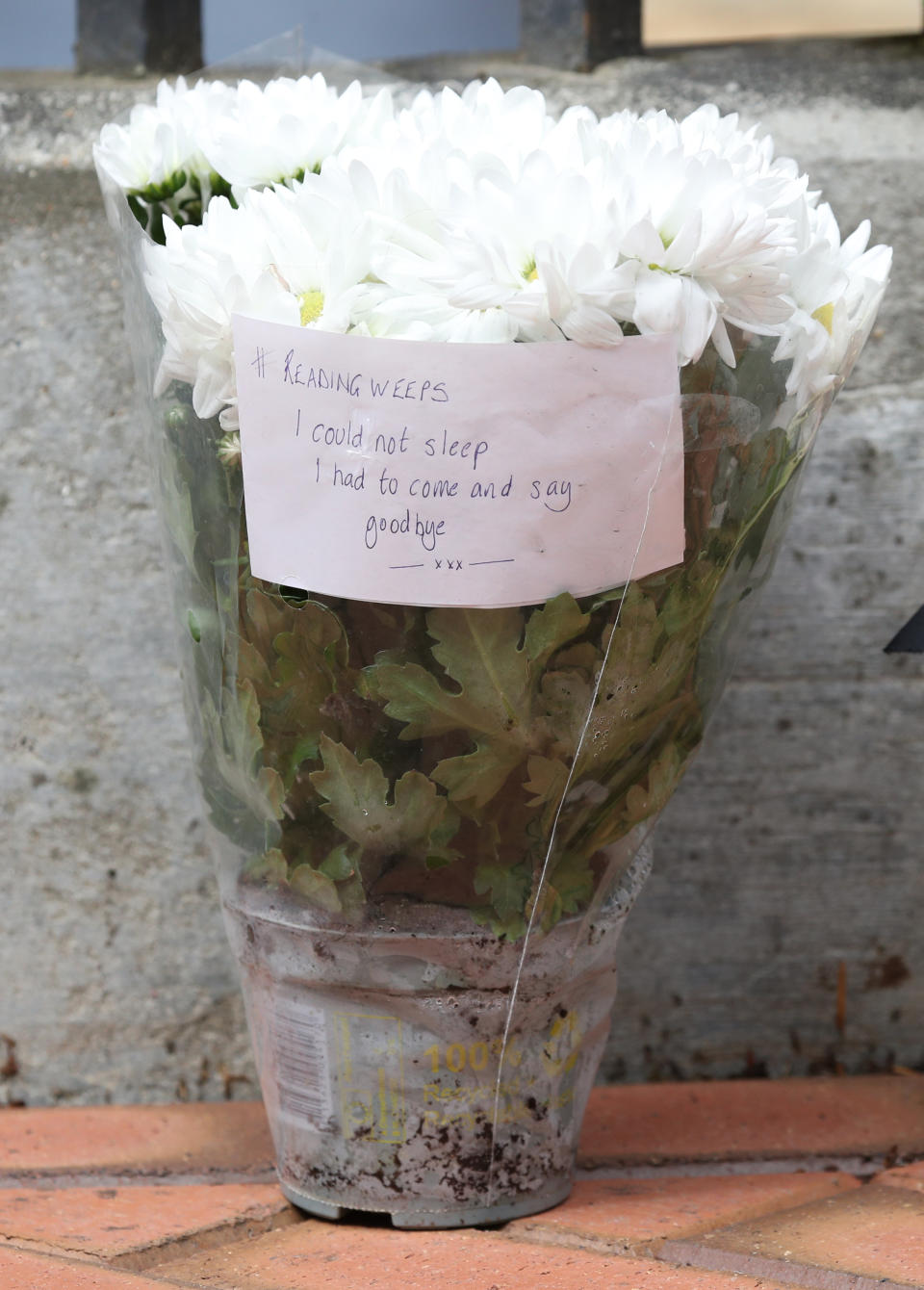 Flowers have been left at the Abbey gateway of Forbury Gardens following the multiple stabbing on Saturday. (PA)