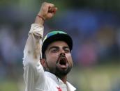 India's captain Virat Kohli celebrates after they won their final test cricket match and the series against Sri Lanka in Colombo, September 1, 2015. REUTERS/Dinuka Liyanawatte