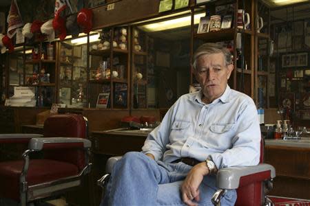 Ray Sanford awaits a haircut in a barbershop in downtown Rogers, Arkansas, December 4, 2013. REUTERS/Andy Sullivan