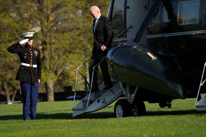 President Biden exits Marine One as he returns to Washington, D.C., from Camp David on Sunday. (Ken Cedeno/Reuters)