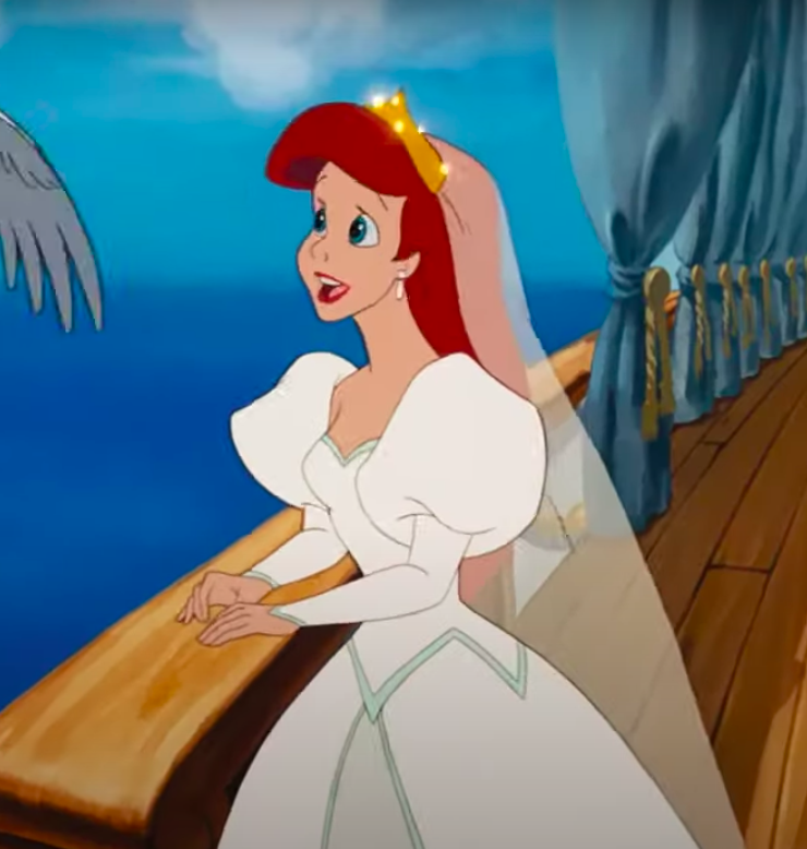 Ariel wearing a dress with big shoulders and then tight sleeves