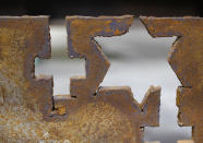 Steel recovered from the World Trade Center that has been cut to make memorial crosses and stars sits inside Hangar 17 at New York's John F. Kennedy International Airport June 16, 2011. A program operated by the Port Authority of New York and New Jersey, The World Trade Center steel program, is selecting portions of the steel recovered from the Center and donating it to cities, towns, firehouses and museums around the U.S. and the world who request it for use in 911 memorial sites in time for the 10 year anniversary of the 2001 attacks. Picture taken June 16, 2011. (REUTERS/Mike Segar)