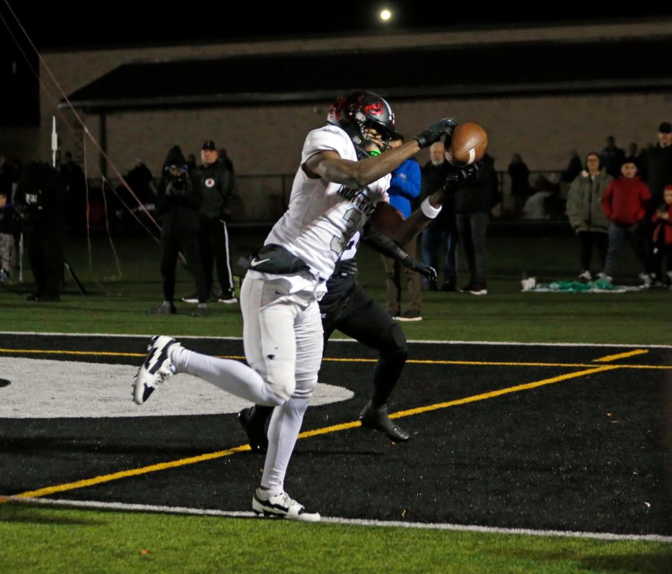 NorthWood senior NiTareon Tuggle catches a touchdown pass in the third quarter of the IHSAA Class 4A football semistate championship game against Leo Friday, Nov. 17, 2023, at Leo High School.