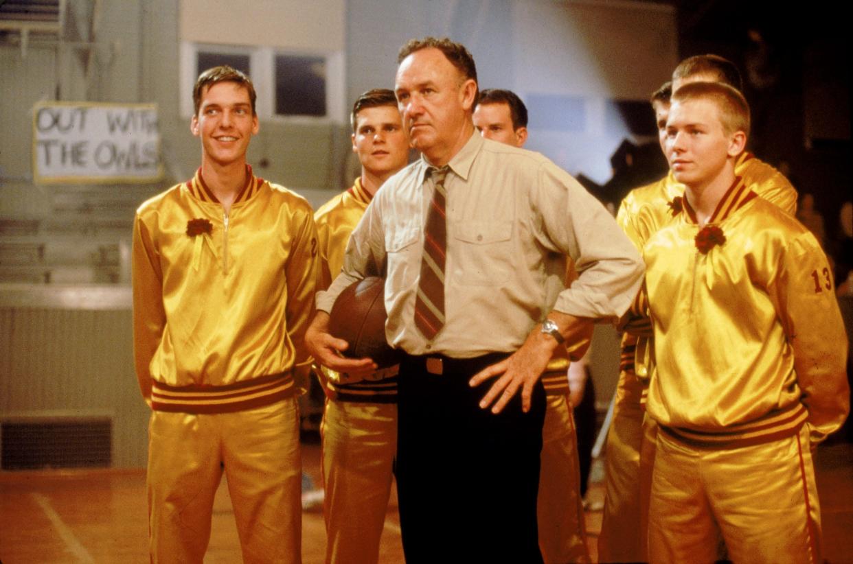 Gene Hackman (center) stars as the coach of small-town Hickory High in the underdog classic 