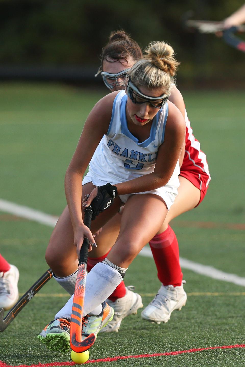 Franklin’s Emily Carney steals the ball during the field hockey game against North Attleborough at Beaver Pond Turf Field in Franklin on Sept. 22, 2022.