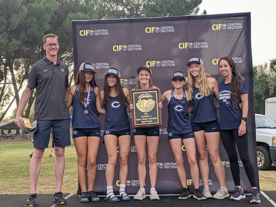 The Central Valley Christian girls cross country team captured the 2021 Central Section Division V team championship on Nov. 18 at Woodward Park in Fresno. The championship team, left to right: coach Scott Kostelyk, Caitlin Chea, Melody Miller, Audrey Dragt, Becky Bryant, Esther Vander Goot, and coach Ally Kornelis.