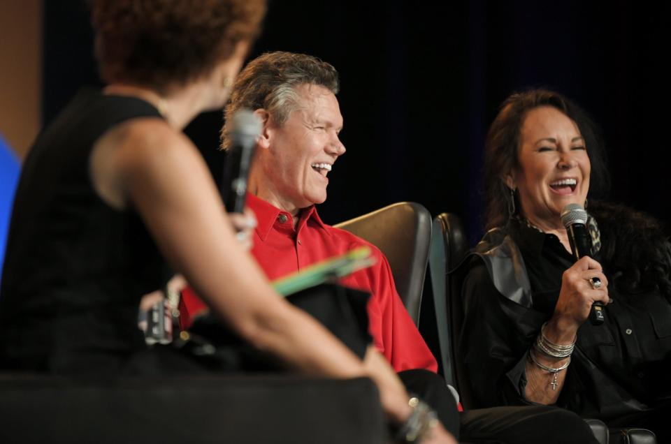 Randy Travis and his wife Mary interact with fans during a meet-and-greet at the 2019 CMA Fest on Friday, June 7, 2019, in Nashville, Tennessee.  