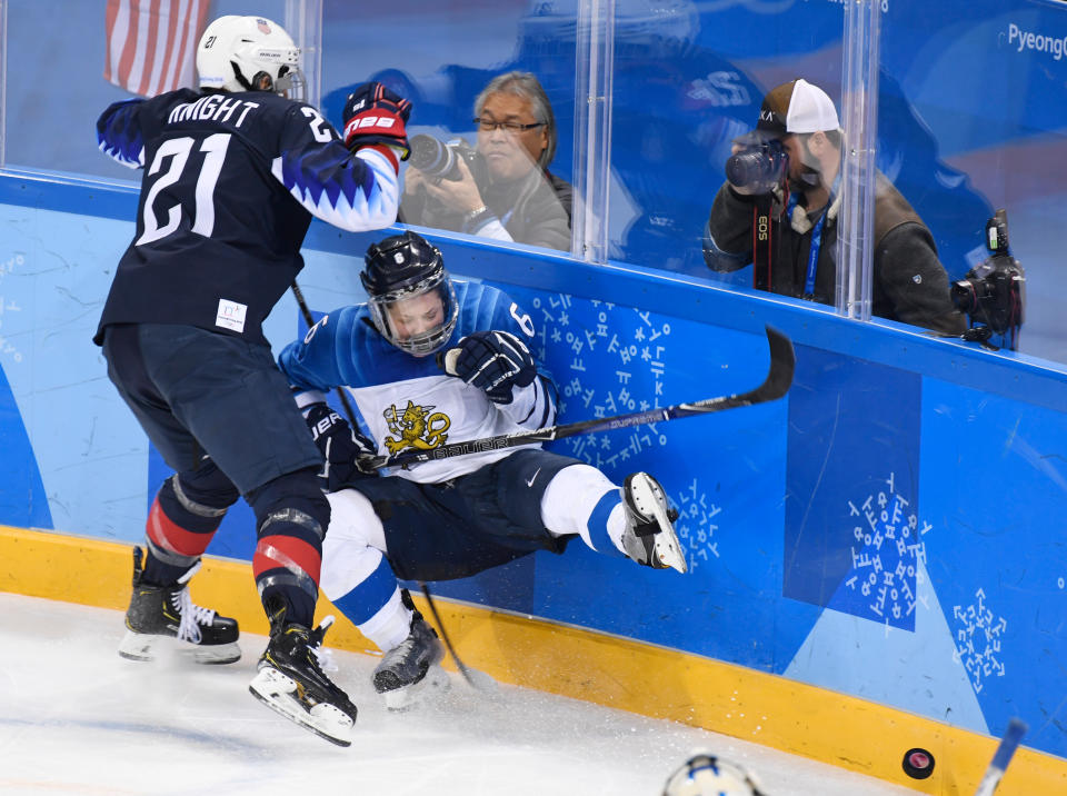 <p>Hilary Knight (21) checks Jenni Hiirikoski (6) during the women’s ice hockey semifinal game between the United States and Finland during the Pyeongchang 2018 Winter Olympic Games at the Gangneung Hockey Centre. February 19, 2018 (Photo by Hyoung Chang/The Denver Post via Getty Images) </p>