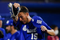 Israel's Danny Valencia wipes his face after a baseball game against the Dominican Republic at the 2020 Summer Olympics, Tuesday, Aug. 3, 2021, in Yokohama, Japan. The Dominican Republic won 7-6. (AP Photo/Matt Slocum)