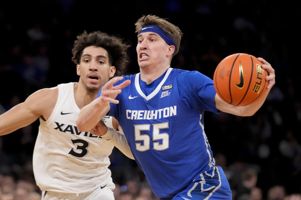 Creighton's Baylor Scheierman (55) drives past Xavier's Colby Jones (3) in the second half of an NCAA college basketball game during the semifinals of the Big East conference tournament, Friday, March 10, 2023, in New York. (AP Photo/John Minchillo)
