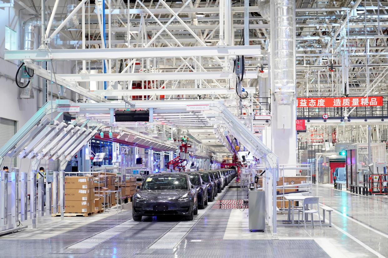 FILE PHOTO: Tesla China-made Model 3 vehicles are seen during a delivery event at its factory in Shanghai, China January 7, 2020. REUTERS/Aly Song