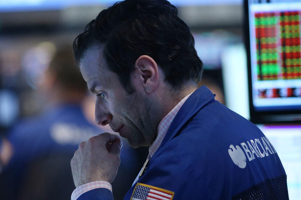 NEW YORK, NY - APRIL 25: A trader works on the floor of the New York Stock Exchange on April 25, 2014 in New York City. With growing concerns about turmoil in Ukraine and worries about the rising costs at the technology giant Amazon, the Dow dropped 140 points Friday with the Nasdaq falling over 1.5%. (Photo by Spencer Platt/Getty Images)