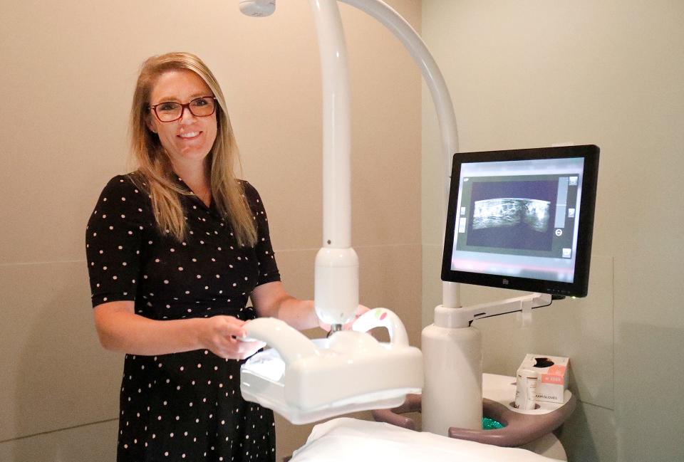 Dr. Jordan Dixon, radiologist at Candler Hospital, with the ABUS/Automated Breast Ultrasound System that helps identify tumors in dense breast tissue.