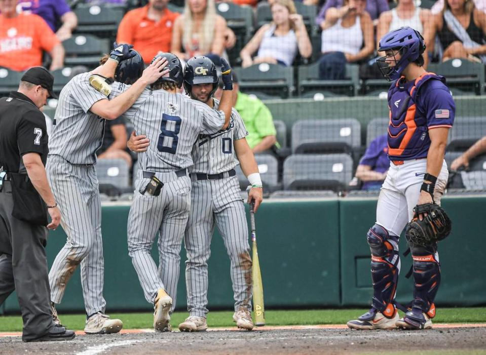 Georgia Tech freshman Drew Burgess (8) is congratulated by teammates near Clemson senior Jimmy Obertop (11) after his home run during the top of the eighth inning of game 2 at Doug Kingsmore Stadium in Clemson Friday, May 3, 2024.