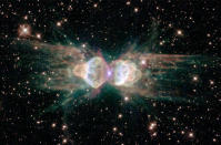 A Hubble Space Telescope image released February 1, 2001 of the so-called "ant nebula" (Menzel 3, or Mz3) reveals the "ant's" body as a pair of fiery lobes protruding from a dying star. The Hubble images directly challenge old ideas about the last stages in the lives of stars. (Photo by NASA/Newsmakers/Getty Images)