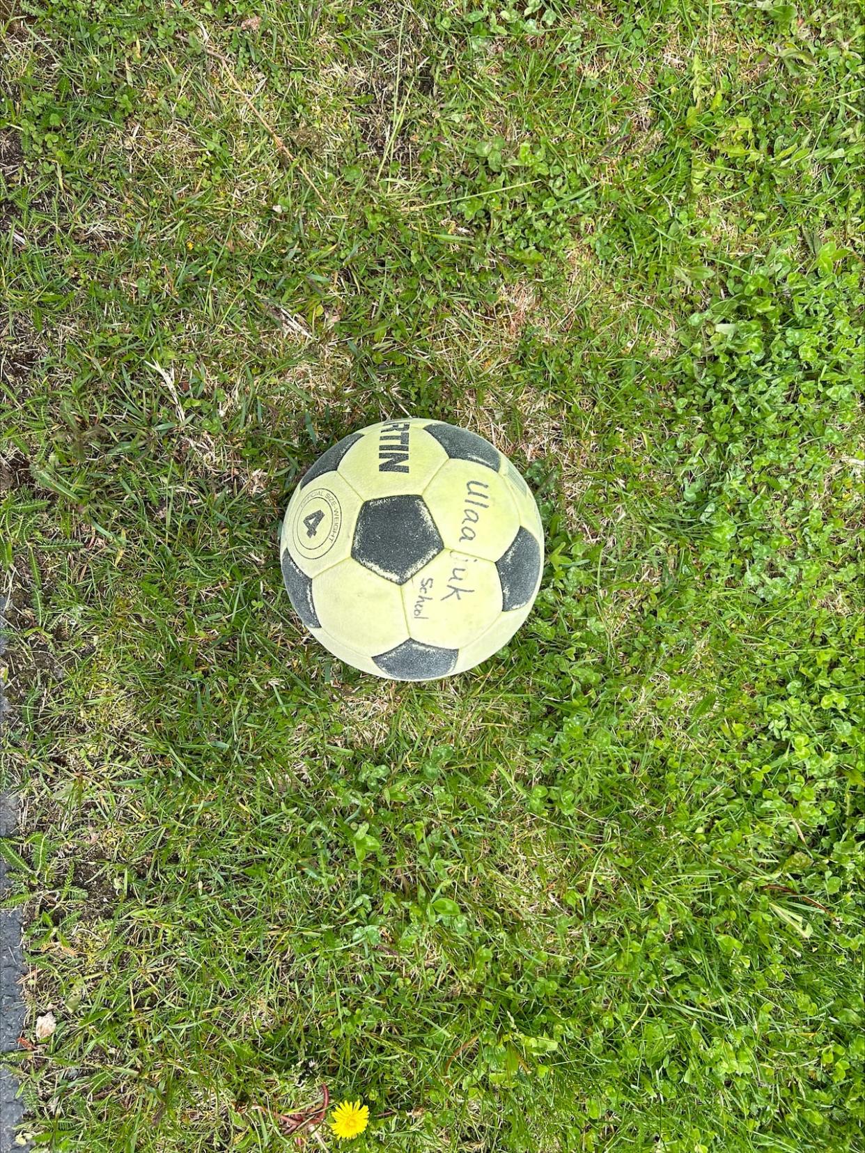 The ball belonged to Ulaajuk Elementary School in Pond Inlet, Nunavut. (Submitted by Lee Croucher. - image credit)