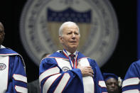 President Joe Biden stands for the national anthem during Howard University's commencement in Washington, Saturday, May 13, 2023. (AP Photo/Patrick Semansky)
