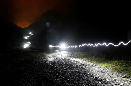 Competitors climb during the 16th Ultra-Trail du Mont-Blanc (UTMB) race at La Balme near Chamonix, France August 31, 2018. REUTERS/Denis Balibouse