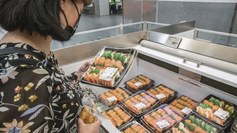 shopper looking at sushi