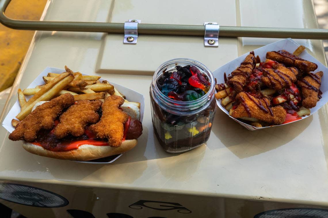 Attraction-themed food for Six Flags Over Texas’ ride Dino Off Road Adventure on Friday, June 21, 2024, in Arlington. . The food consisted of dinosaur nuggets, fries, hotdogs and a dessert with dinosaur gummies.