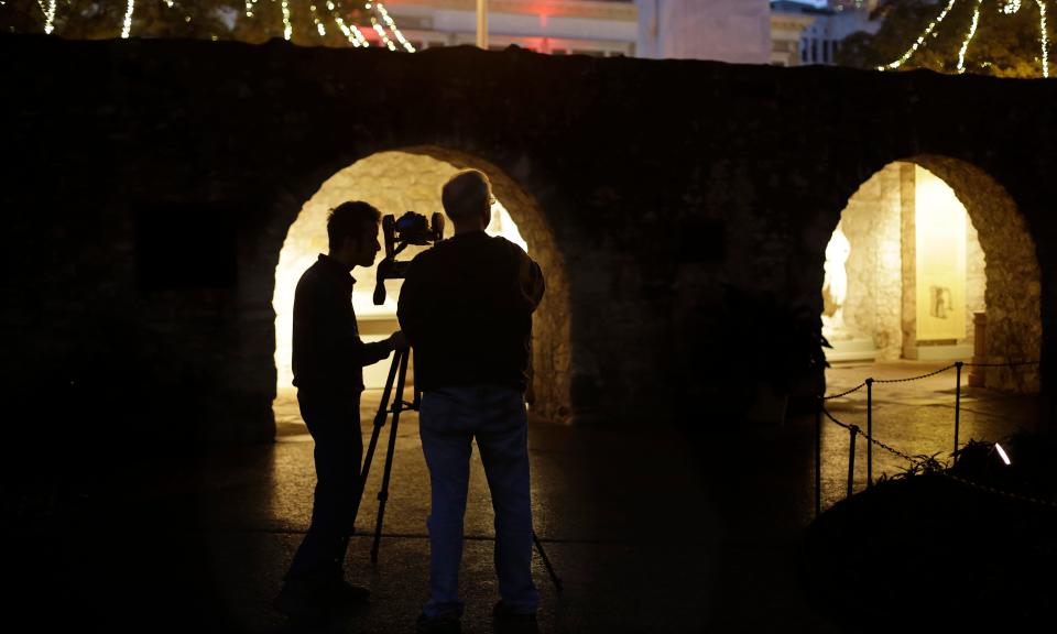 In this Jan. 9, 2014 photo, Soheil Hamideh, left, and Bob Warden, right, professor of architecture and director of the Center for Heritage Conservation at Texas A&M, use a camera to record images of the Alamo's long barrack, which was originally constructed in 1724.