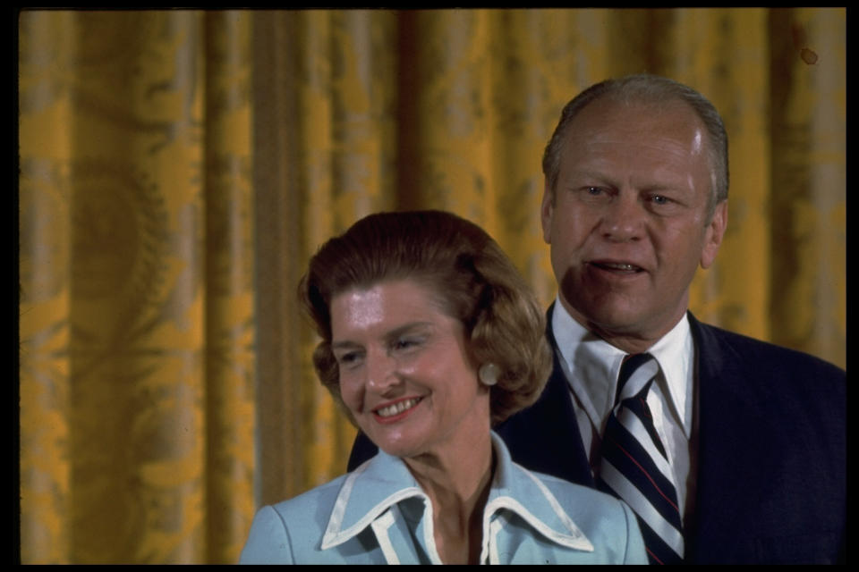 Betty Ford stands in front of husband Gerald Ford on his inauguration day, Aug. 9, 1974. Ford took office immediately after Nixon's resignation.