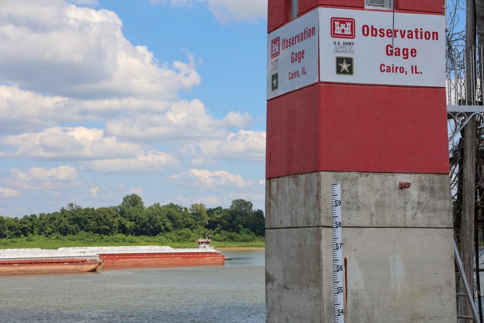 A towboat passes the river level gauge at Cairo, Illinois, where the Ohio and Mississippi rivers meet.