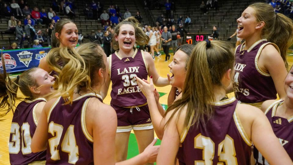 Columbia City Eagles yell in excitement during the Hall of Fame Classic girls basketball tournament at New Castle Fieldhouse in New Castle. The Columbia City Eagles defeated the Jennings County Panthers, 56-47.