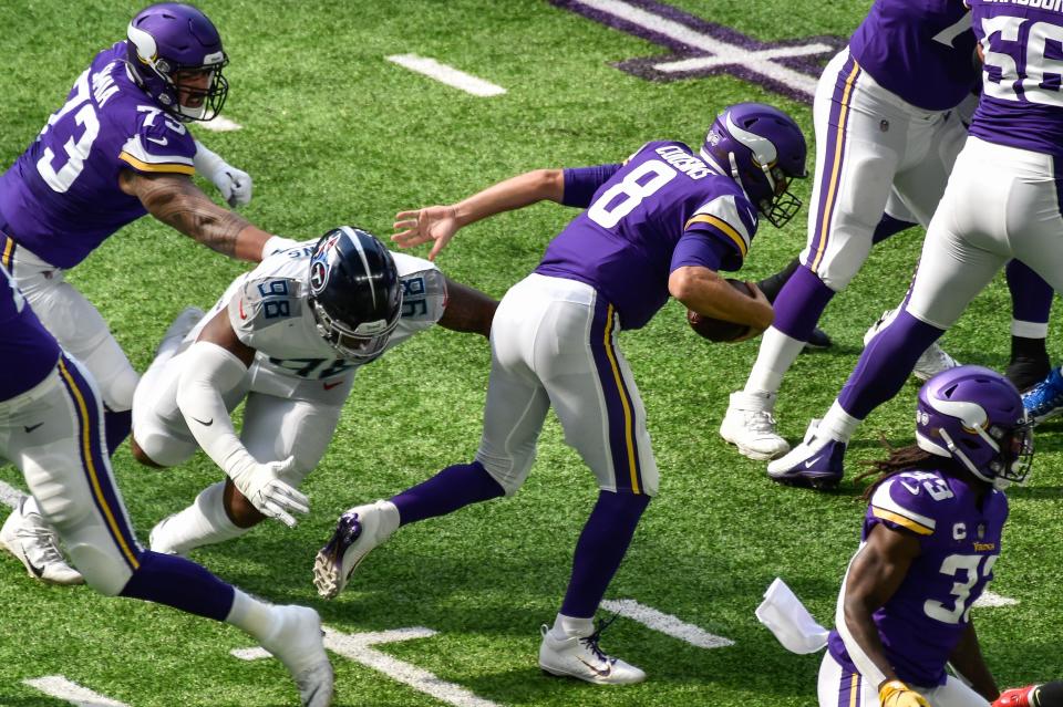 Titans defensive tackle Jeffery Simmons sacks Vikings quarterback Kirk Cousins during the first quarter, Sept. 27, 2020, in Minneapolis.