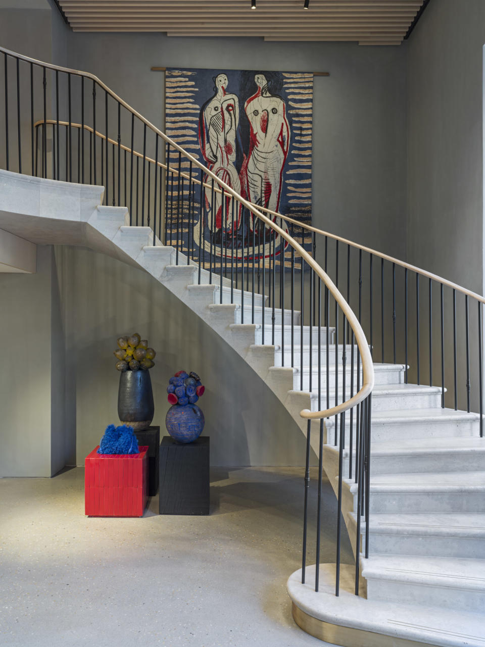 A Henry Moore tapestry punctuates the Georgian-style staircase. - Credit: Courtesy of Loewe