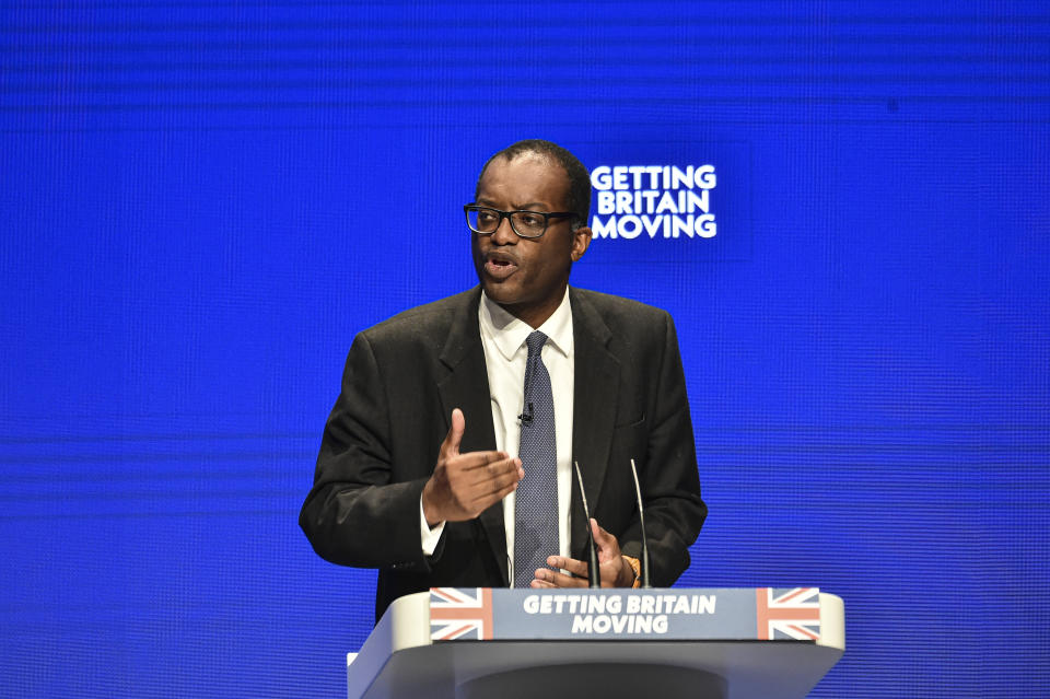 Britain's Chancellor of the Exchequer Kwasi Kwarteng speaks at the Conservative Party conference at the ICC in Birmingham, England, Monday, Oct. 3, 2022. The British government has dropped plans to cut income tax for top earners, part of a package of unfunded cuts that sparked turmoil on financial markets and sent the pound to record lows. (AP Photo/Rui Vieira)