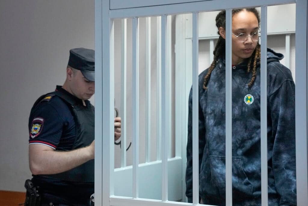 WNBA star and two-time Olympic gold medalist Brittney Griner stands in a cage at a court room prior to a hearing, in Khimki just outside Moscow, Russia, Tuesday, July 26, 2022. (AP Photo/Alexander Zemlianichenko, Pool)