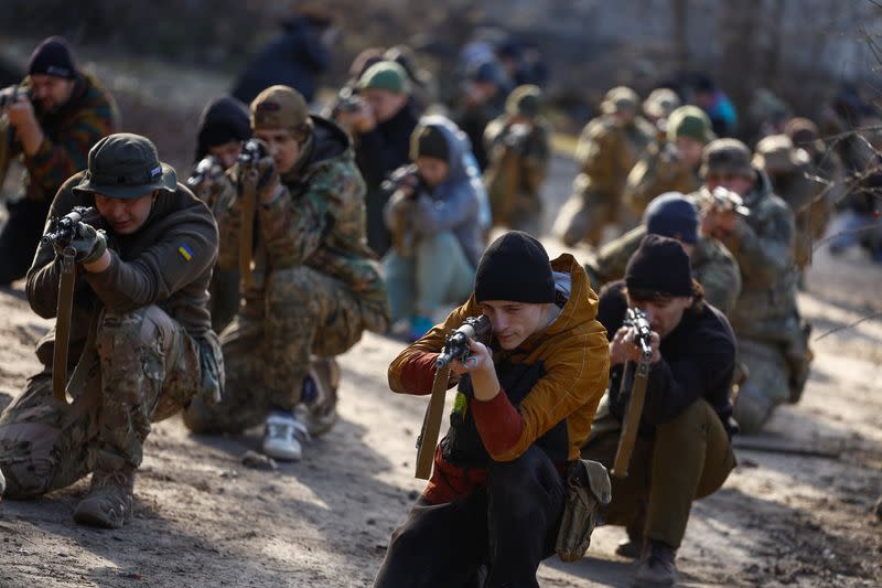 Potential recruits who aspire to join the 3rd Separate Assault Brigade of the Ukrainian Armed Forces take part in a testing basic military course in Kyiv