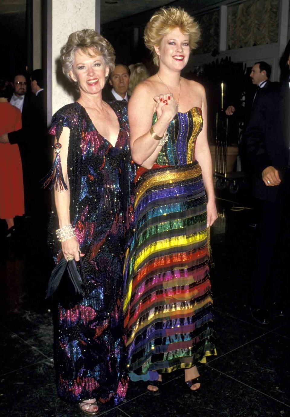 <p>The mother-daughter duo hit the 1987 Golden Globes in full '80s regalia, decked out in colorful sequin dresses. Melanie was nominated for best actress for her role in <em>Something Wild;</em> while she didn't win, she went on to take home the award two years later for her turn in <em>Working Girl. </em></p>