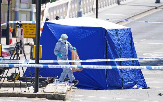 A police forensic officer at the scene at Cheyne Walk, Chelsea - Dominic Lipinski/PA Wire