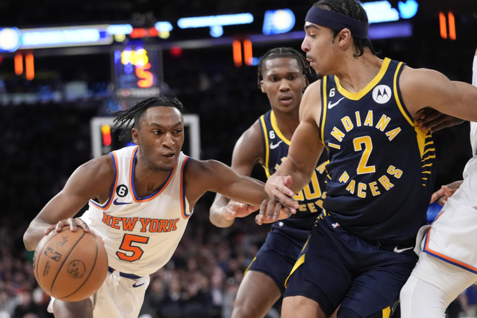 New York Knicks guard Immanuel Quickley (5) drives to the basket against Indiana Pacers guard Andrew Nembhard (2) in the second half of an NBA basketball game, Wednesday, Jan. 11, 2023, at Madison Square Garden in New York. (AP Photo/Mary Altaffer)