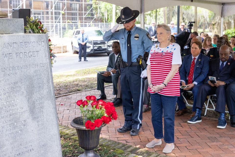 Family members of fallen officers joined CCPD Officer Andrew Nizwantowski as he placed a rose at the memorial in honor of their loved one on Wednesday, May 15, 2024.